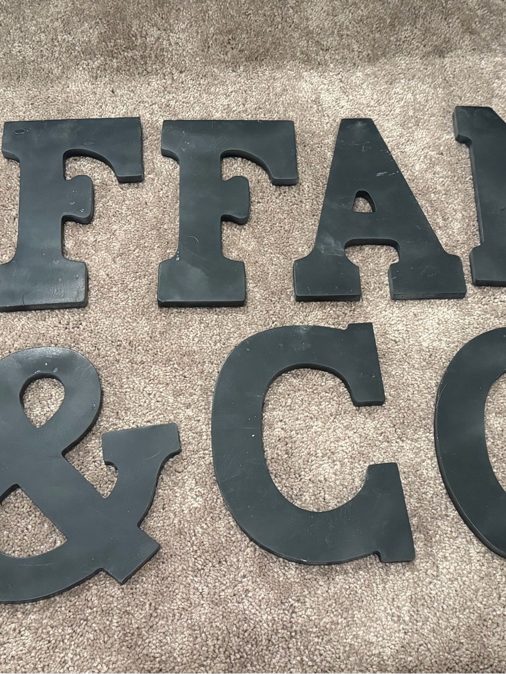 Wooden letters that spell Tiffany & Co